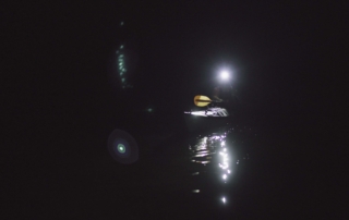 Kayaker sailing on a dark morning with his Suprabeam S3 headlamp